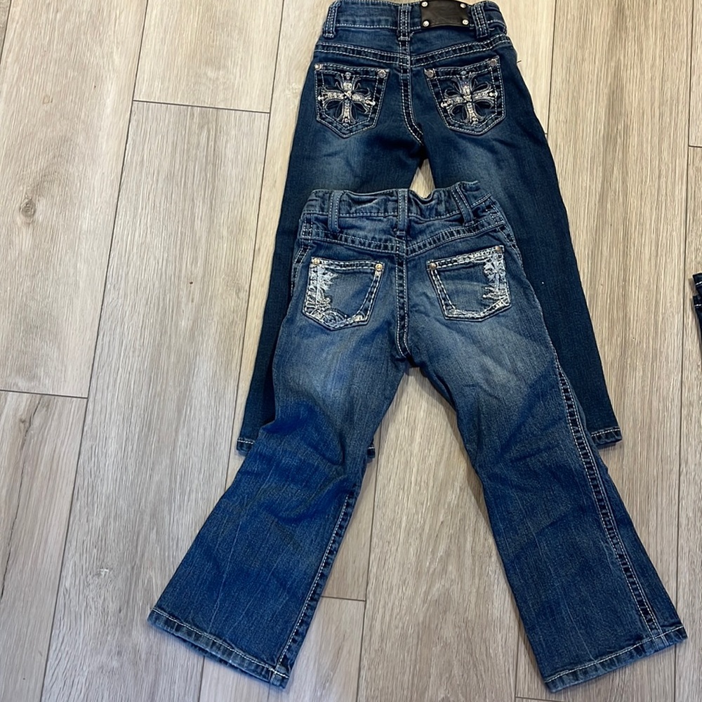 Girls Jeans size 4- Rock 47 and wired heart jeans. Both are in good condition.